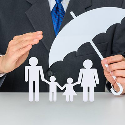 Employee Benefit Plans​. Businessman protects family members e.g parents and two child